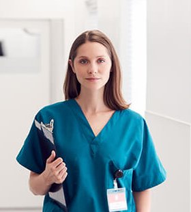 female doctor standing in clinic corridor g2aqw5c 1.jpg